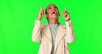 Green screen, direction or happy woman, pointing up and excited for commercial, sales promo or news deal. Offer, chroma key happiness or female ambassador gesture at announcement on studio background