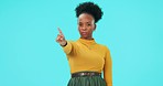 Upset, face and woman with rejection gesture in studio for warning, alert or prohibition symbol. Serious, angry and portrait of African female model with no hand sign by blue background with mockup.