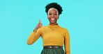 Thumbs up, bad review and recommend with a black woman on a blue background in studio for choice or decision. Portrait, survey and options with a young female influencer doing a product comparison