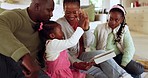 High five, tablet and parents playing with their children in the living room for bonding together. Happy, love and African family streaming online game on the internet with digital technology at home