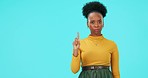 Angry, danger and woman with rejection gesture in studio for warning, alert or caution symbol. Upset, serious and portrait of African female model with prohibition sign by blue background with mockup