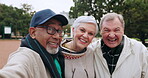 Selfie, senior friends and smile outdoor at a park for social media, travel memory and love. Profile picture, diversity and elderly man and woman together in nature for retirement holiday or wellness