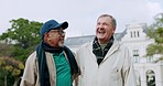 Nature, discussion and mature friends walking in an outdoor park for fresh air and exercise. Happy, conversation and senior friends speaking while bonding, having fun and exploring a garden together.