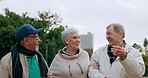 Nature, conversation and senior people walking in an outdoor park for fresh air and exercise. Happy, smile and elderly friends talking while bonding, having fun and exploring green garden together.
