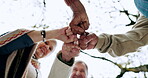 Senior people, fist bump and nature fitness, outdoor wellness and retirement support, teamwork or motivation. Happy elderly friends with hands together sign for winter, health and forest below