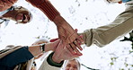 Hands, together and below team motivation or celebration of success, collaboration or goals in outdoor sport. Winning, teamwork and people with support, solidarity and cheering for community mission 