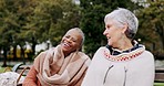 Senior women on bench in park with talk, friends and outdoor adventure in garden for quality time. Happiness, friendship and retirement, old people bonding together in nature for freedom and fun.