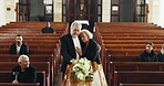 Funeral, church and couple hug by coffin for goodbye, mourning and grief in memorial service. Depression, sad family and man embrace woman by casket in chapel for greeting, loss and burial for death