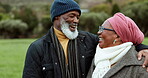 Love, laughing or old couple hug in park with joy or smile in nature outdoors in countryside together. Black people, mature or happy man bonding to enjoy holiday vacation with a funny senior woman