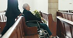 Death, funeral and church with old woman and wheelchair user for sad, mourning and widow. Depression, grief and help with person with a disability at chapel for bereavement, burial ceremony and loss