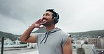 Fitness, music and smile with a sports man turning around, looking at the view in a harbor during his workout. Exercise, thinking and inspiration with a happy young male athlete training outdoor