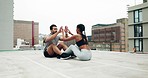 Young couple, crunch exercise and outdoor on roof, high five and smile with motivation, support and strong abdomen. Man, woman and workout together for stomach muscle, goals and teamwork in metro cbd