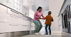 Mother, kitchen and black family child dancing, smile and enjoy quality bonding time together, fun and excited energy. Holding hands, happiness and home mom, mama or African woman teaching young kid