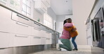 Hug, kitchen and black family child, happy mother  and embrace, bonding and enjoy quality time together. Love, happiness and home mom, mama or African parents hugging, support and care for young kid