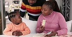 Parents, child and education for learning card, reading and support of studying knowledge. Mom, dad and happy black family helping kid for homeschool, teaching language development or alphabet letter