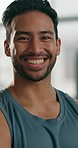 Fitness, workout and face of man in the gym after strength training for health or muscles. Happy, sports and portrait of a strong male athlete body builder after an arm exercise in sport center.