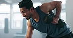 Fitness, exercise and a man with a dumbbell at gym for body builder training and wellness. Profile of Asian person with focus for power, strong muscle and workout at bench for motivation and health