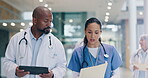 Tablet, report and nurse talking to doctor in hospital lobby for advice on team surgery, medicine or health insurance. Teamwork, woman and black man speaking with information, document or support