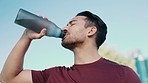 Fitness, tired and outdoor man drinking water for sports thirst hydration, body cooling or nature exercise in park. Wellness, dehydration fatigue and face of sweaty male runner with liquid beverage