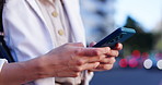 Woman, phone and hands typing in city for networking, online browsing or outdoor communication. Closeup of female person chatting, texting or social media on mobile smartphone app in an urban town