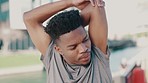 Fitness, wellness and man stretching his arms in an outdoor park for race or marathon training workout. Nature, health and male runner athlete doing warm up exercise ready for cardio running in field