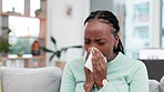 Sneeze, blowing nose and sick black woman with tissue on a sofa for allergies, hay fever or viral infection at home. Sneezing, bacteria and African lady with congestion, covid or flu in living room