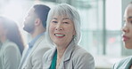 Face, smile and a business asian woman in a workshop with colleagues for training at a conference. Portrait, audience and senior employee in a seminar for planning or coaching with an employee team