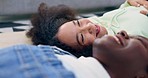 Floor, happy and talking friends in a home for bonding, freedom and love together in the living room. Smile, diversity and laughing women on the lounge ground for conversation, communication or joke