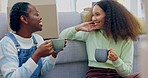 Coffee, moving and lgbt women in new home to relax, smile and excited future investment together. Real estate, love and mortgage, happy lesbian couple with boxes, drink and tea at sofa in apartment.