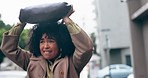 Rain, woman running in city and bag over head outdoor in urban town. Wet, girl and handbag cover in street, shield or protection of water drops in winter weather, travel or sad African person commute