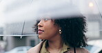 Morning, rain and a woman with an umbrella in the city for travel, thinking and winter. Looking, street and a young girl with gear for bad weather while in town for a commute, traveling or covering