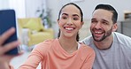 Selfie, couple and home with laughing and profile picture for social media in living room. Marriage, happy and post with love and care in a new house together excited from property and real estate