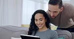 Couple, talking and relax on tablet on sofa for internet browsing, social media or blog reading in house. Smile, bonding or biracial man and happy woman on digital technology in home for web research