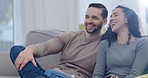 Funny, streaming and couple watching tv, relax and films with happiness, laughing and loving together. Humor, woman and man with love, entertainment and television with marriage, home or subscription