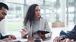 Business woman, meeting and speaking, planning or employees management with tablet, writing notes and feedback. Professional manager and people listening, talking and proposal for company strategy
