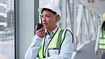 Mature woman, radio communication and construction worker, instruction and maintenance with inspection. Architect, walkie talkie and speaking with contractor, urban infrastructure and engineering