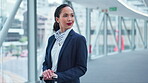 Airport, suitcase and a business woman thinking while waiting for her international travel flight. Smile, idea and luggage with a young air hostess on a bridge in a departure or arrival terminal