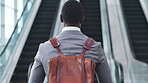 Back, businessman and walking to escalator in airport, travel or commute of professional employee with backpack or luggage. Work, trip and bag for journey to convention, conference or office building