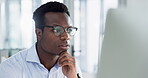 Business man, computer and thinking in office with information, research or data analysis at desk. Face of serious black man with technology or internet for decision, reading email or problem solving