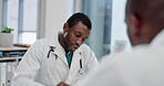 Healthcare, writing or black man consulting doctor in a hospital for results, diagnosis or planning treatment. Notes, advice or African patient with specialist to check schedule info for medical test