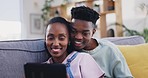 Tablet, black couple and happy in home, talking and bonding on living room sofa. African man, woman and tech, smile and streaming movie, video or film, social media and online shopping on internet