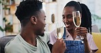 Black couple, toast and champagne glass in home, smile and bonding in living room house. African man, woman and wine cheers, drink and happy, care and love celebration, relax and funny laugh together