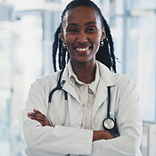 Face, arms crossed and a doctor black woman in the hospital for ...