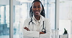 Face, arms crossed and a doctor black woman in the hospital for positive diagnosis or treatment you can trust. Portrait, healthcare and smile with a happy medical professional in a health clinic