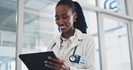 Doctor, woman and tablet in hospital for healthcare information, online charts and medical check or research. African nurse or professional scroll on digital technology for clinic schedule or results