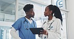 Planning, tablet and a doctor in discussion with a nurse in the hospital about healthcare diagnosis. Medical, teamwork or records with a medicine professional and assistant in a clinic for treatment