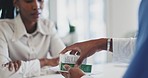 Doctor, black woman and patient with medication in consultation, pills or checkup at the hospital. Sick African female person receiving drugs, medicine or note for prescription or diagnosis at clinic