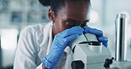 Black woman, scientist and microscope, analysis in laboratory with medical research and check sample in experiment. Future, doctor and investigation with scientific study and learning with pathology