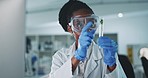 Black woman, gloves and plant in test tube, scientist in lab with medical research and ecology with sample. Environment study, liquid solution and analysis of leaves, green and scientific experiment