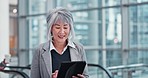 Escalator, tablet and mature businesswoman in a building networking on social media or mobile app. Digital technology, travel and female lawyer doing research at an airport or hotel lobby for seminar